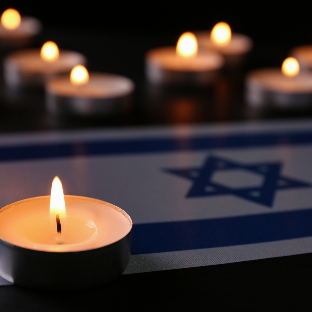 yahrzeit candles with an israeli flag